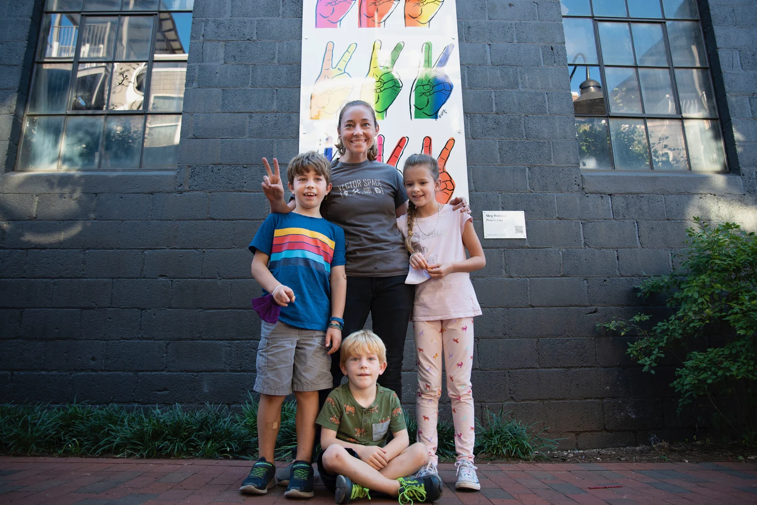 Visitors exploring the Art Alley installation