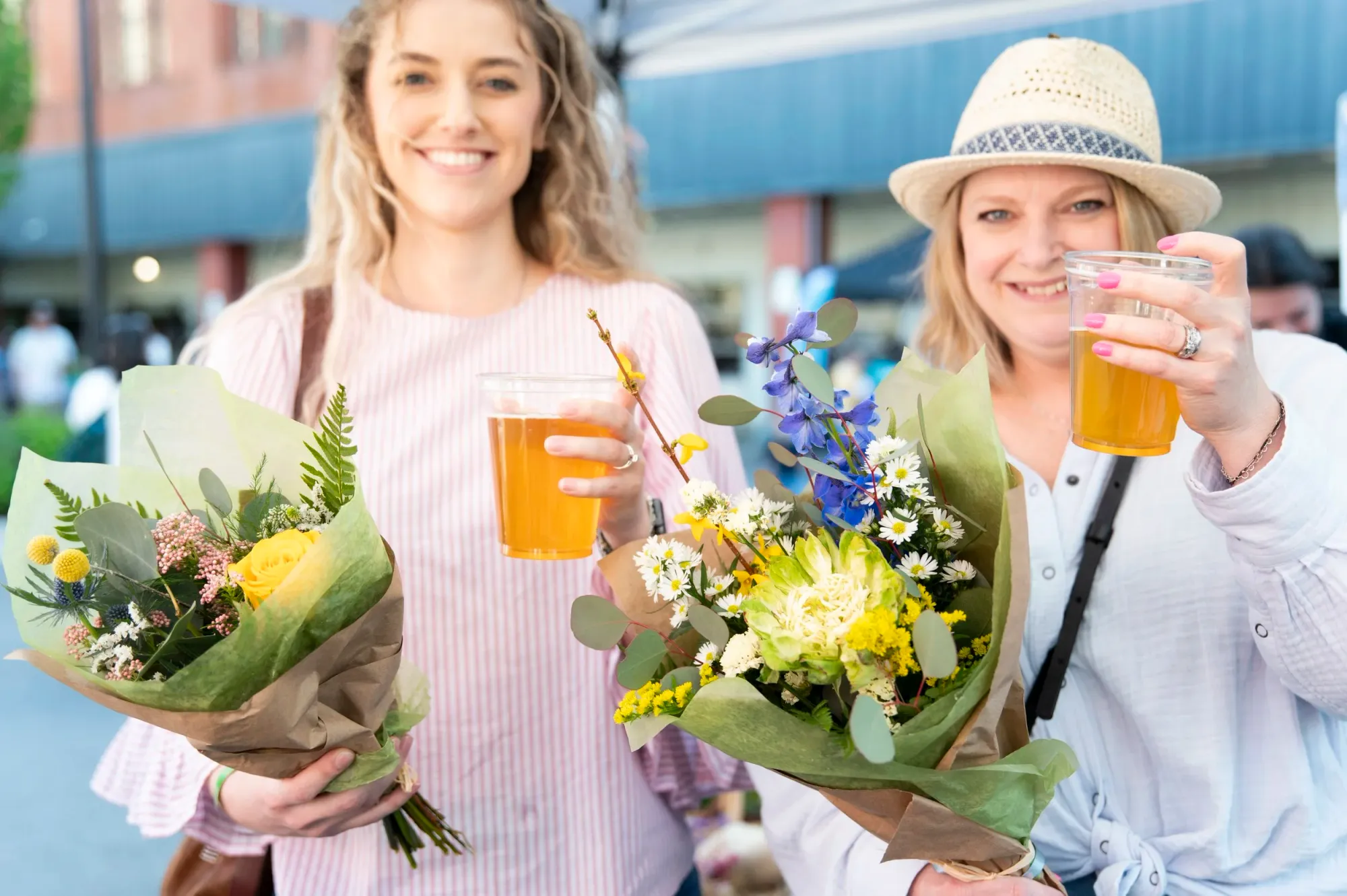 Friends sharing local craft beer at Blooms & Brews