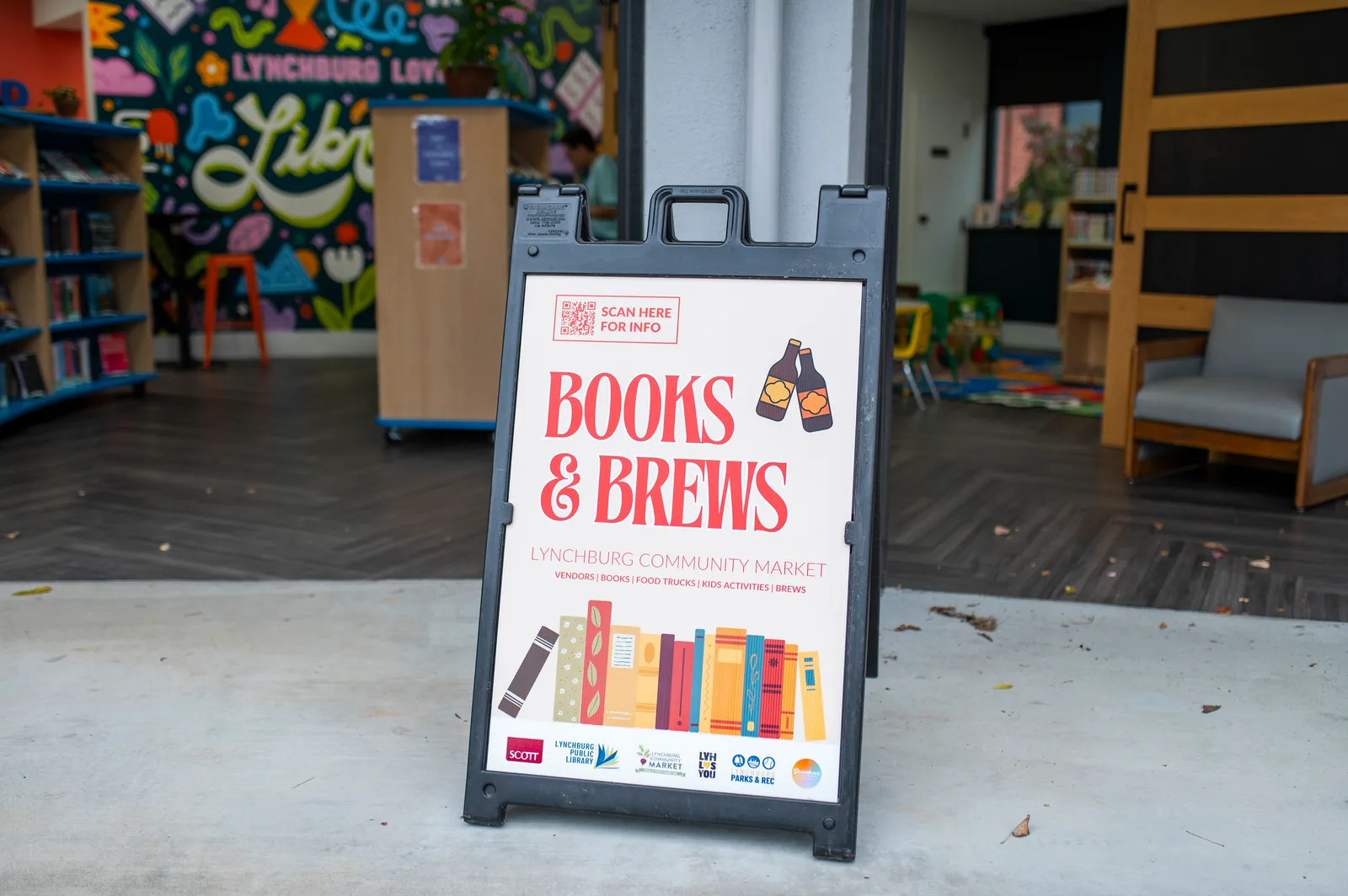 Books & Brews sign outside the Lynchburg Public Library’s downtown branch