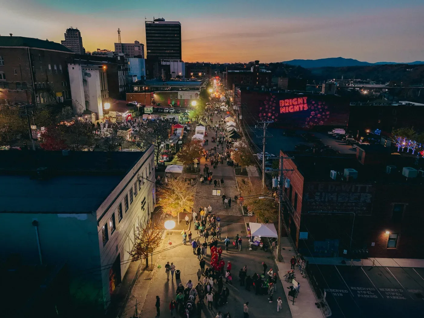 Aerial view of Bright Nights lighting up Commerce Street in Downtown Lynchburg at dusk