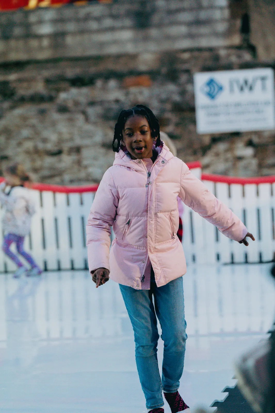 A girl skating on the pop-up ice rink at Bright Nights