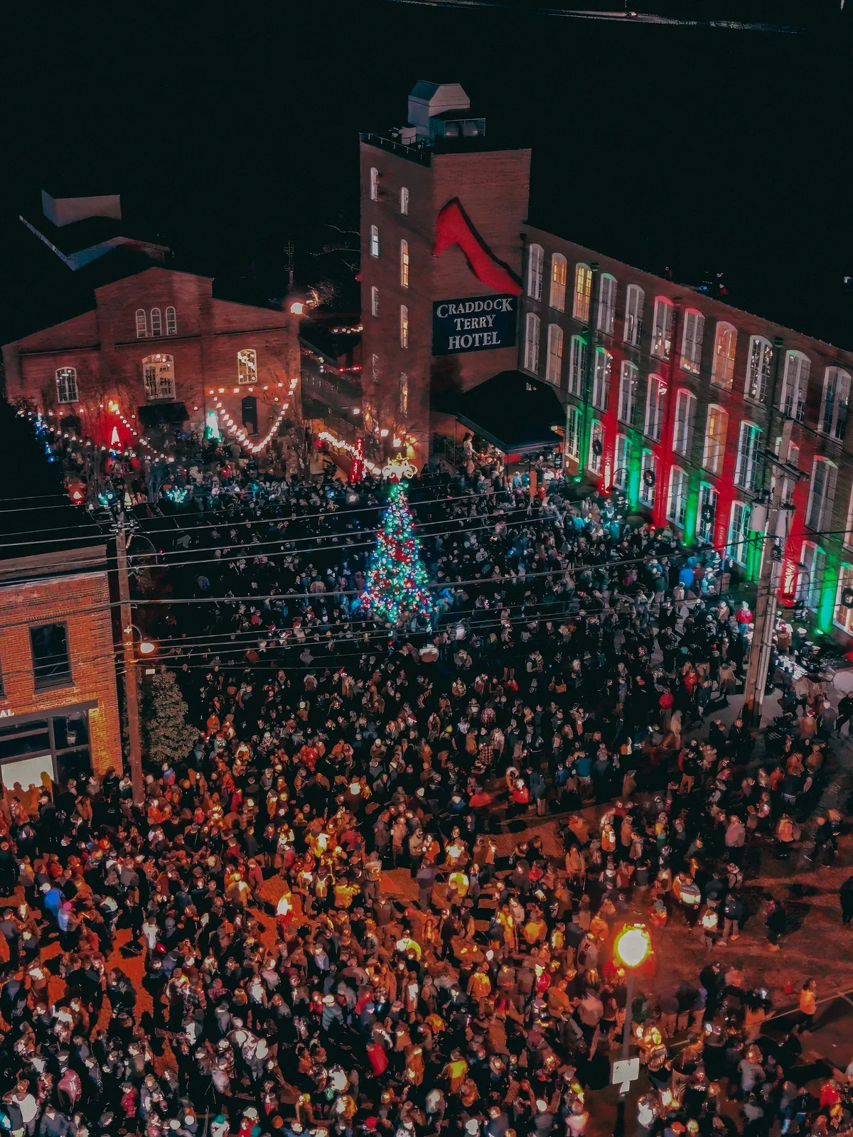 Aerial view of the crowd packed around the Christmas tree outside the Craddock Terry Hotel during Bright Nights