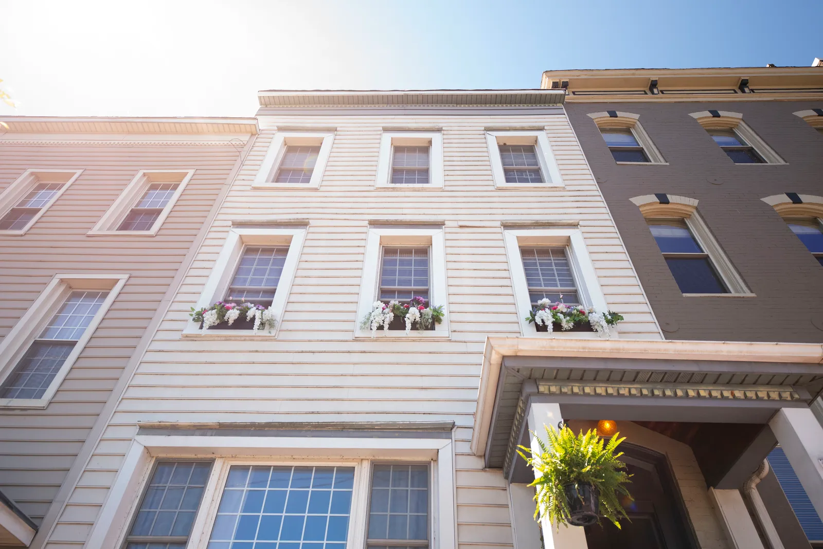 Historic downtown Lynchburg building facade with flower-filled window boxes